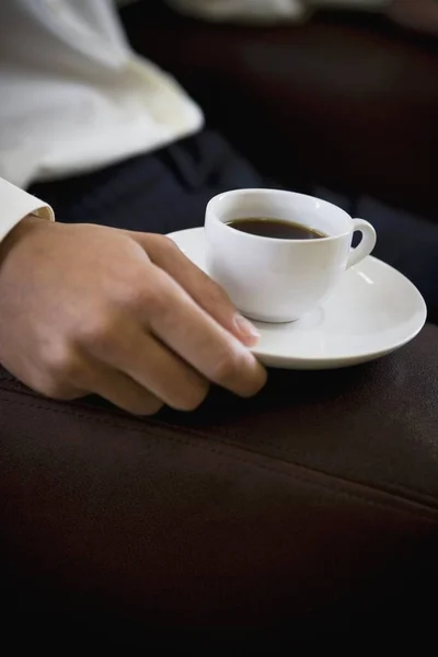 Man holding espresso cup — Stock Photo, Image