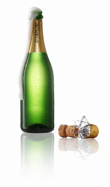 Champagne bubbling out of the bottle — Stock Photo, Image