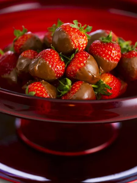 Strawberries dipped in dark chocolate — Stock Photo, Image