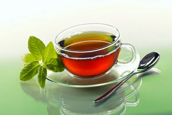 Peppermint tea in glass cup — Stock Photo, Image