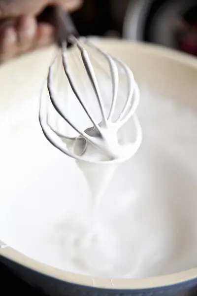 Beaten Meringue with whisk — Stock Photo, Image