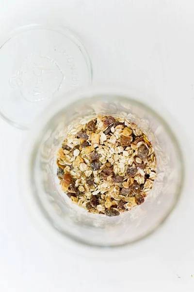 Muesli with raisins in glass — Stock Photo, Image