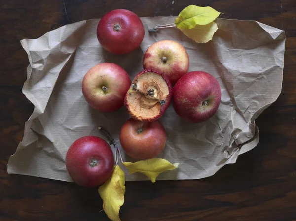 Red apples on piece of paper — Stock Photo, Image