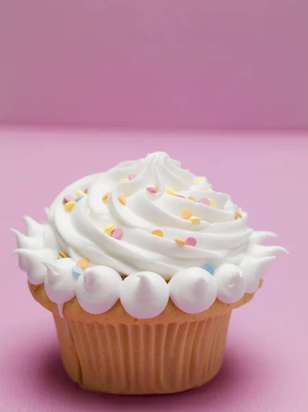 Cupcake with cream and sugar — Stock Photo, Image