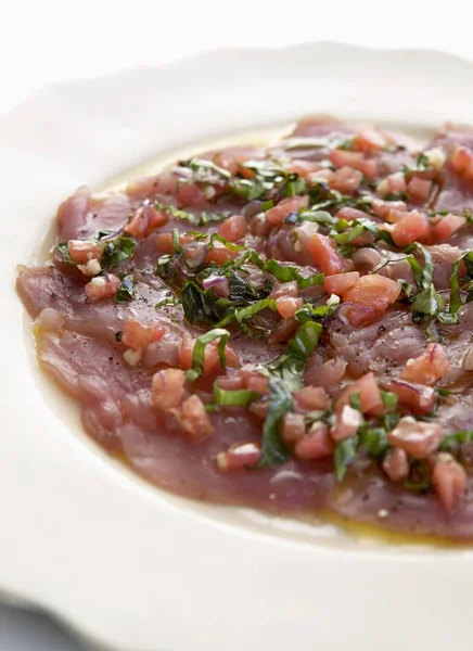Tuna carpaccio with herbs — Stock Photo, Image