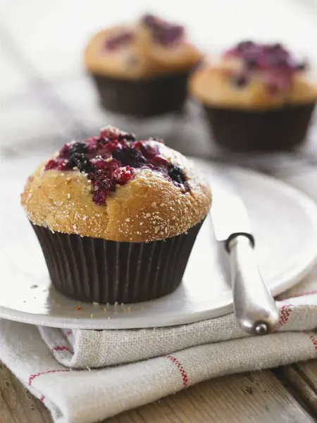 Berry muffins in paper cases — Stock Photo, Image