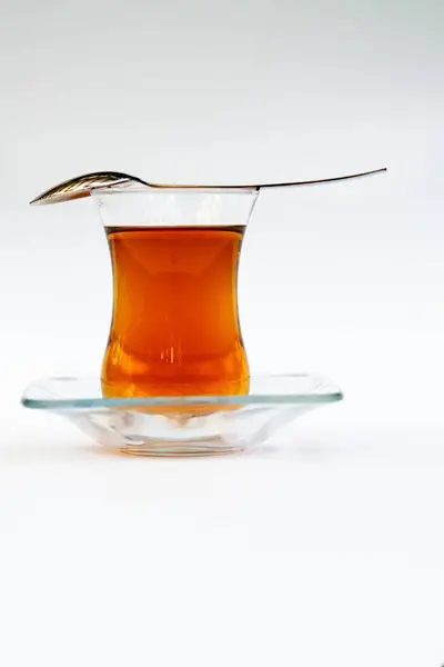 Asian tea in glass with spoon — Stock Photo, Image