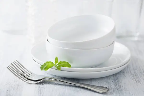 Stacked dinner bowls and plates — Stock Photo, Image