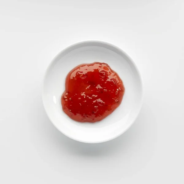 Část malinový džem v misce — Stock fotografie