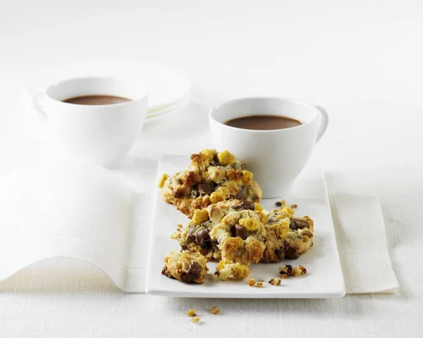 Muesli bites cookies and cups of coffee — Stock Photo, Image