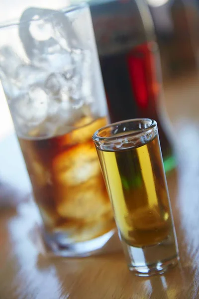 Cocktails in glasses over table — Stock Photo, Image