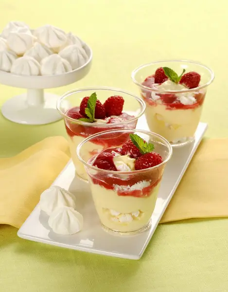 Raspberry desserts with cream — Stock Photo, Image