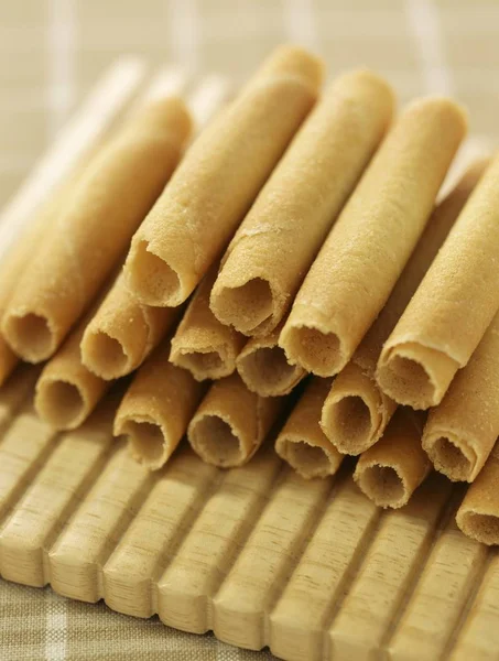 Rolled biscuits on tablecloth — Stock Photo, Image