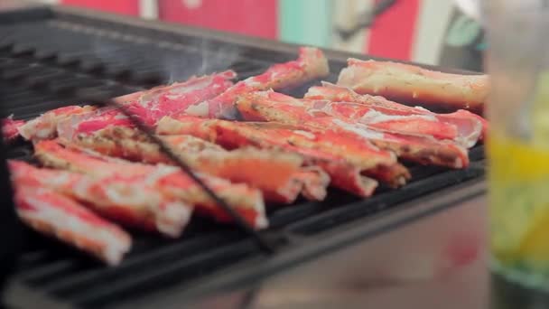 Crab sticks cooking on lattice grill outdoor. — Stock Footage Crab sticks cooking on lattice grill outdoor. Video Clip