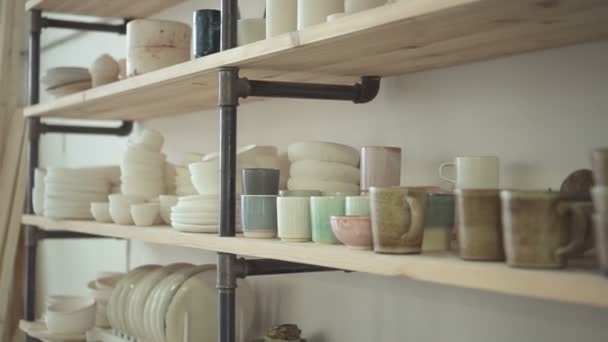 Close Up Of Shelves In Bright Ceramic Studio With Dishes On It Close Up Of Shelves In Bright Ceramic Studio With Dishes On It Stock Footage