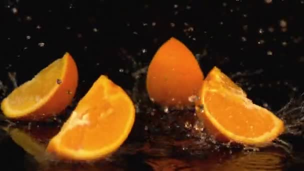 Three videos of falling oranges in real slow motion — Stock Video