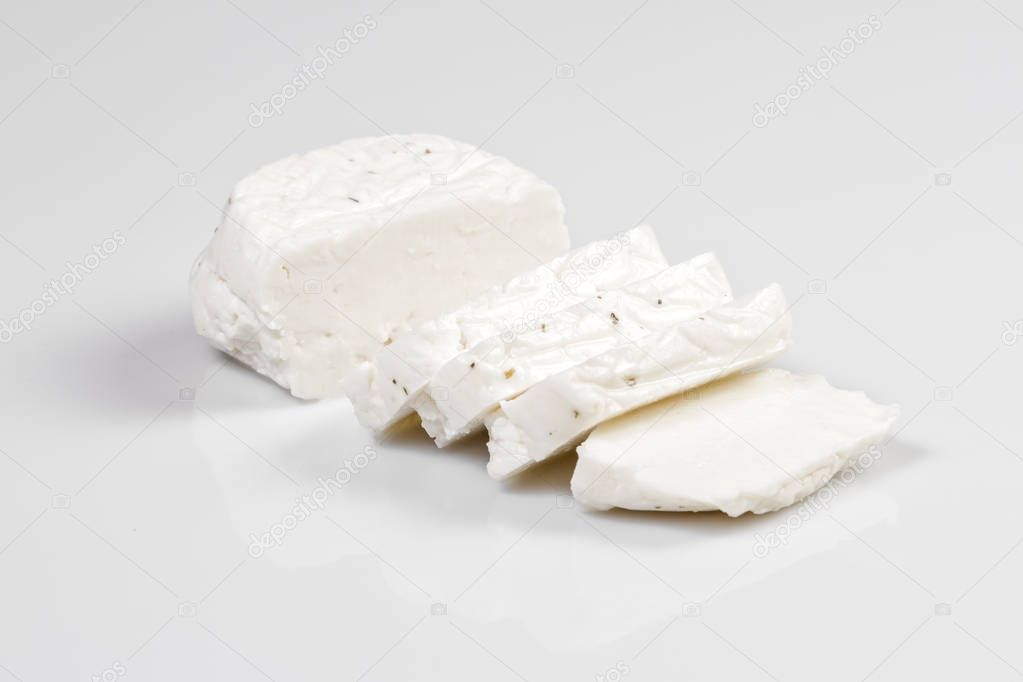 Sliced halloumi cheese with mint isolated on white