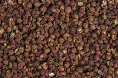 Sichuan biber arka planı. Doğal baharat dokusu. Yiyecek malzemesi..