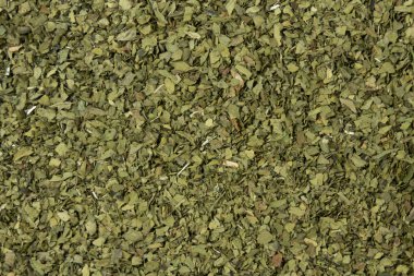 Kurumuş aşk bitkisi arka planı. Doğal baharat dokusu. Baharatlar ve yemek malzemeleri..