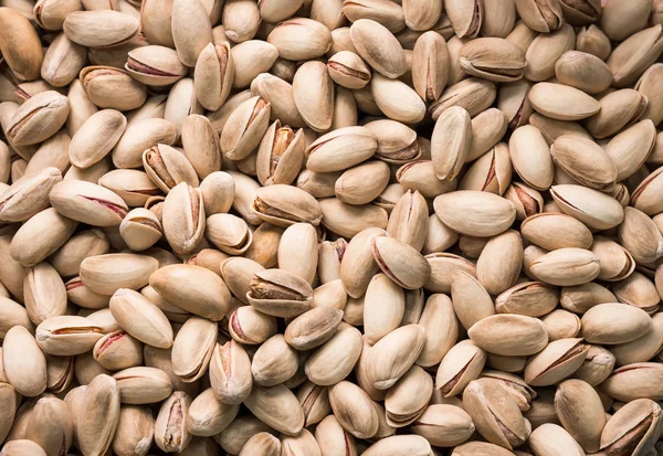 Kavrulmuş ve tuzlu fıstık üstten görünüm. Arka plan, doku.