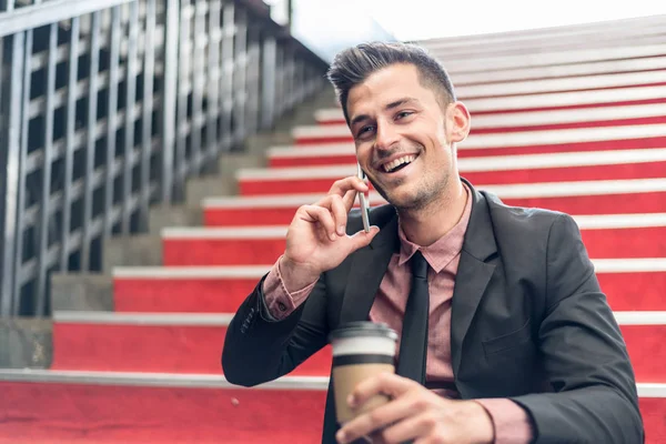 Man close up with a mobile phone and coffee — Stock Photo, Image