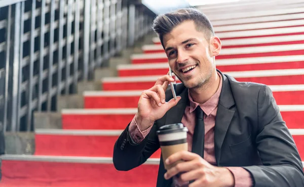 Man close up with a mobile phone and coffee — Stock Photo, Image