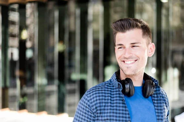 Man close up with headphones smiling — Stock Photo, Image