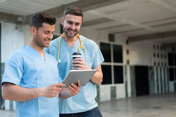 Two male nurse with stethoscope and tablet — Stock Photo, Image
