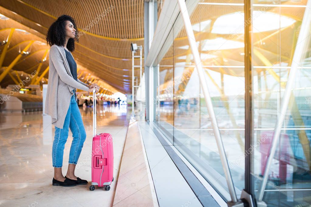 woman front walking at the airport