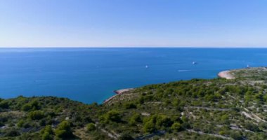 aerial view of island with blue sea water