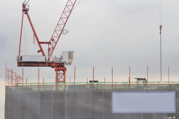 Red crane is under construction.