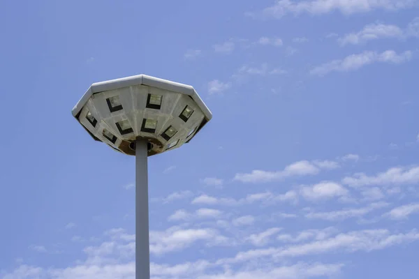 Lamp post of octagon it old have rusty with blue sky