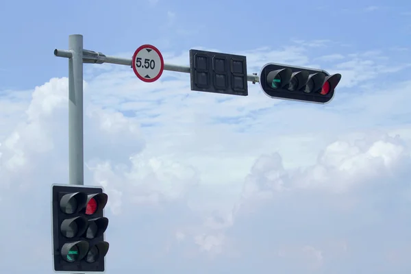 Traffic light and signboard limit of height on blue sky backgrou
