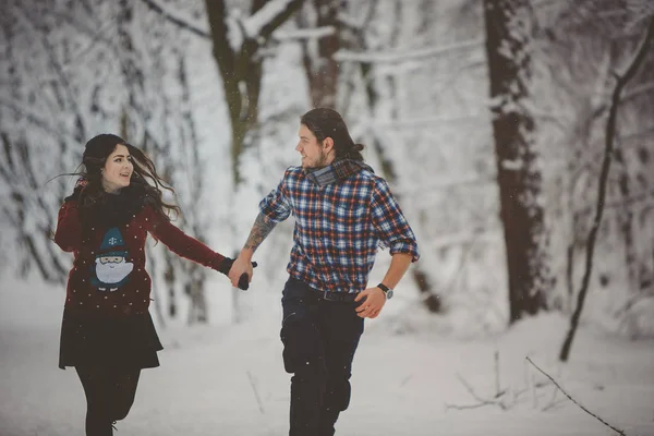 Happy Couple Walking in Winter Park Stock Image