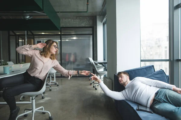 The girl and the young man made a parody of the painting The Creation of Adam in the office.