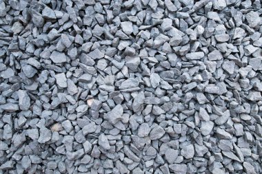 The texture of crushed stone. Gray crushed stone texture. Materials for construction. clipart
