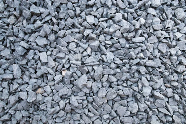 De textuur van steenslag. Grijze gemalen steen textuur. Bouwmaterialen.. — Stockfoto