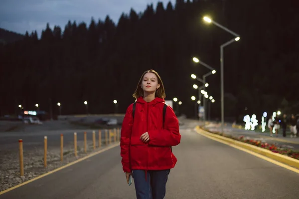 Hiker Girl Red Raincoat Walking Mountain Road Illuminated Lanterns Coniferous — Stock Photo, Image