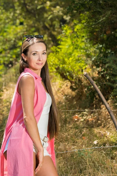The beautiful girl in a pink cape — Stock Photo, Image