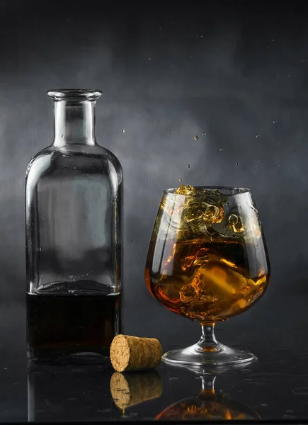 Spray in cognac glass — Stock Photo, Image