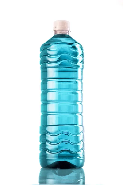 Turquoise drink in plastic bottle on white background — Stock Photo, Image