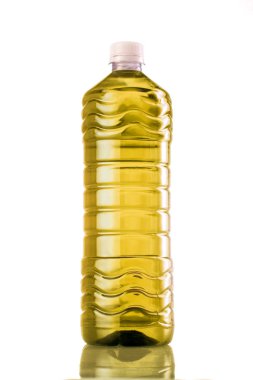 Yellow drink in plastic bottle on white background
