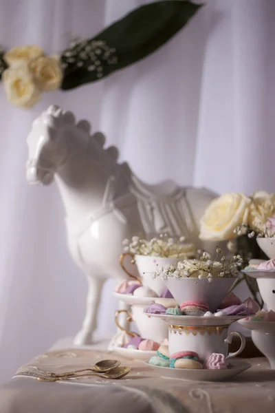 Closeup Horse Statue Table Cups Sweets Flowers — Stock Photo, Image