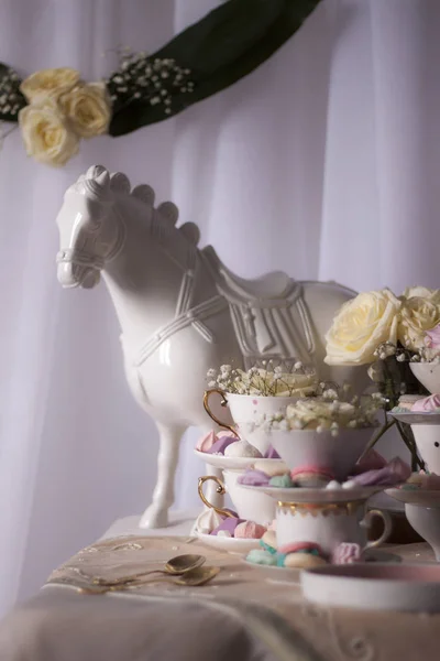 Closeup Horse Statue Table Cups Sweets Flowers — Stock Photo, Image