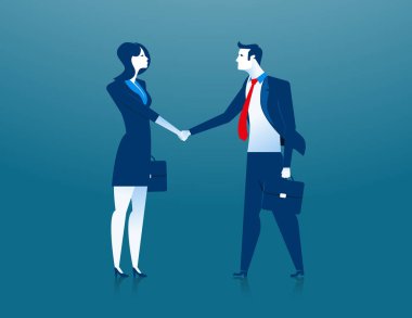 İş kadını ve işadamı el sıkışıyor