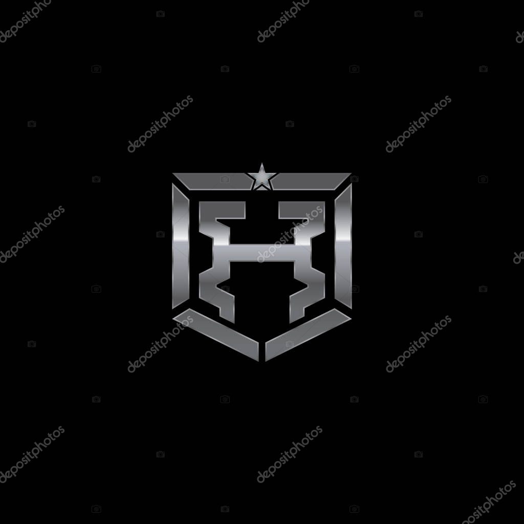 Metallic military shield badge with a combination of letter H