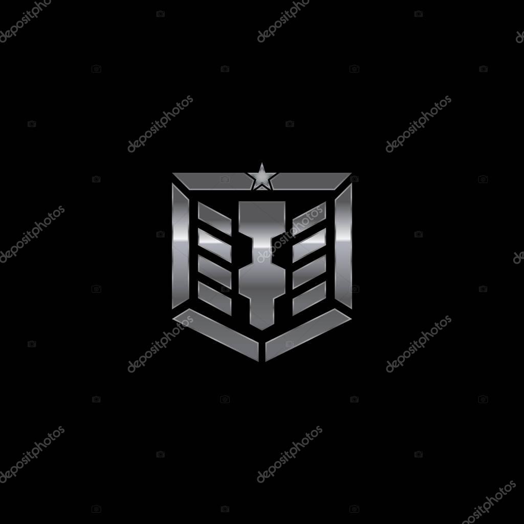Metallic military shield badge with a combination of letter I