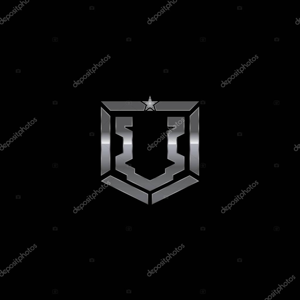 Metallic military shield badge with a combination of letter U