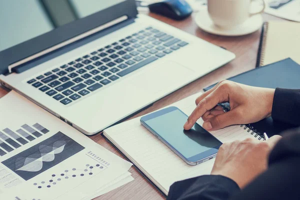 Close Up of woman hands using mobile phone and laptop computer with blank copy space screen for your advertising text message or content business in the Vintage effect. — Stock Photo, Image