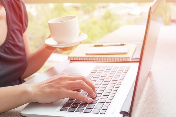 Close Up of women hands using mobile phone and laptop computer with blank copy space screen for your advertising text message or content business in the Vintage effect. — Stock Photo, Image